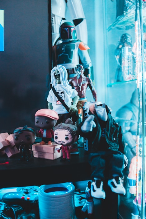 A colorful display of limited edition Funko Pop figures arranged on shelves with soft lighting.