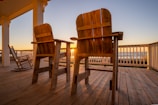 two brown wooden armchairs on brown wooden deck during daytime