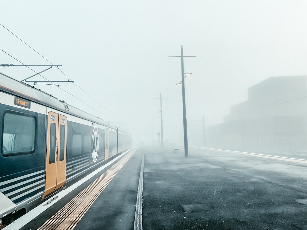 yellow and black train on rail road