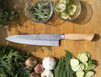 sliced vegetables and meat on chopping board