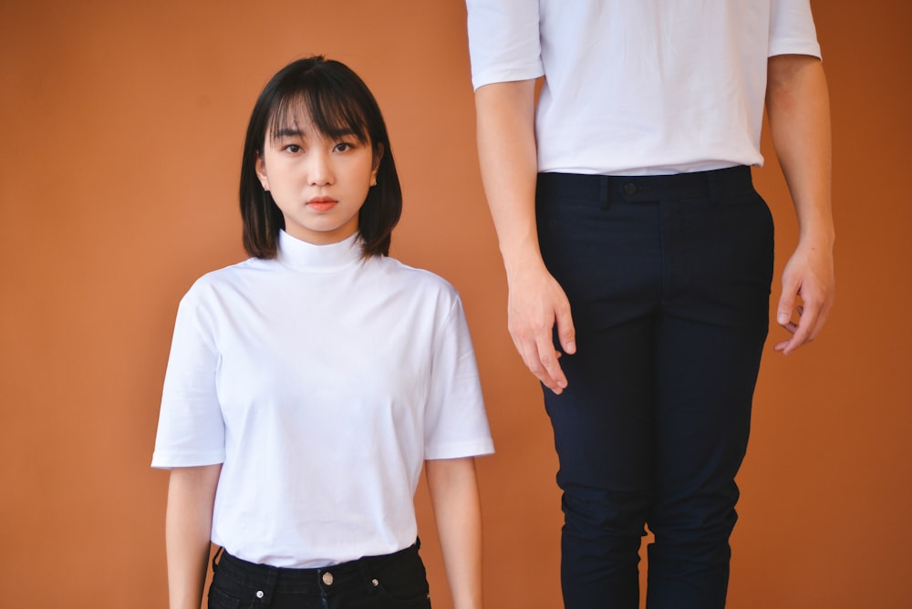 woman in white crew neck t-shirt and black pants