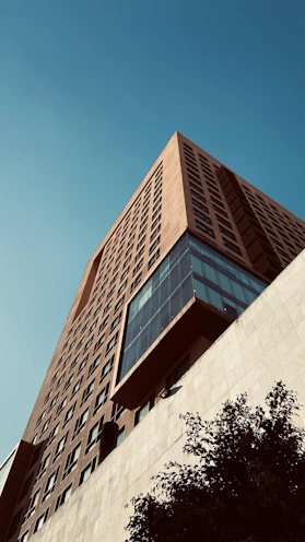 brown concrete building under blue sky during daytime