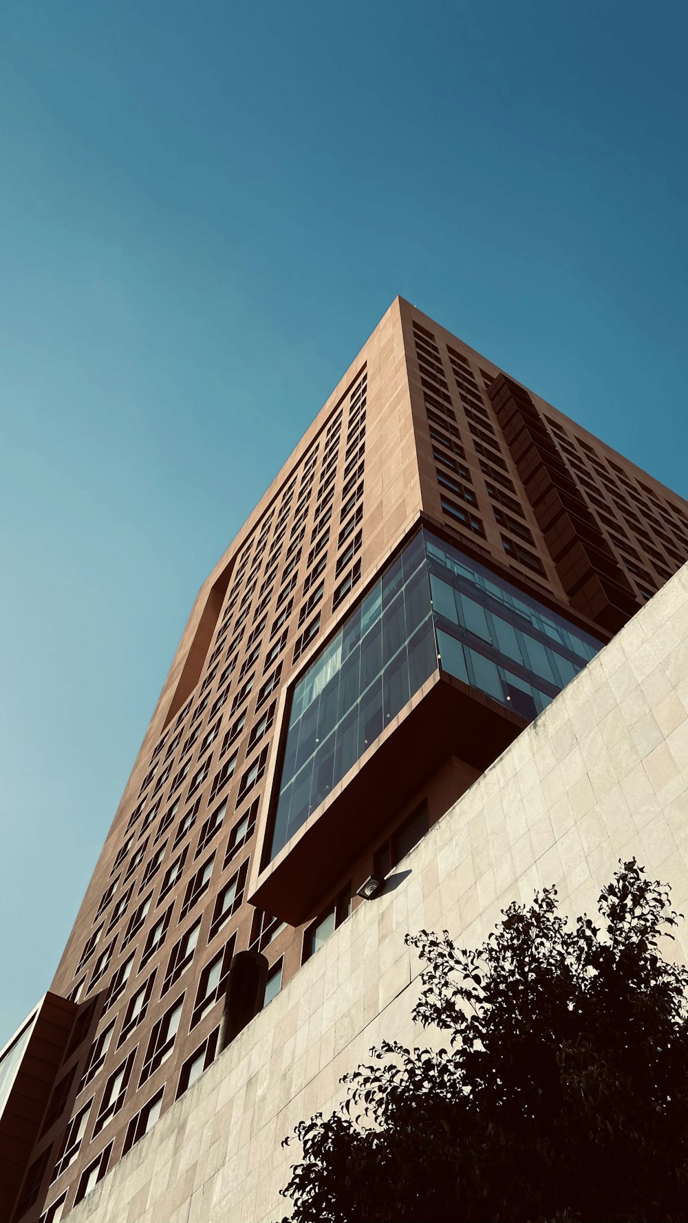 brown concrete building under blue sky during daytime