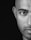 mans face in grayscale photography