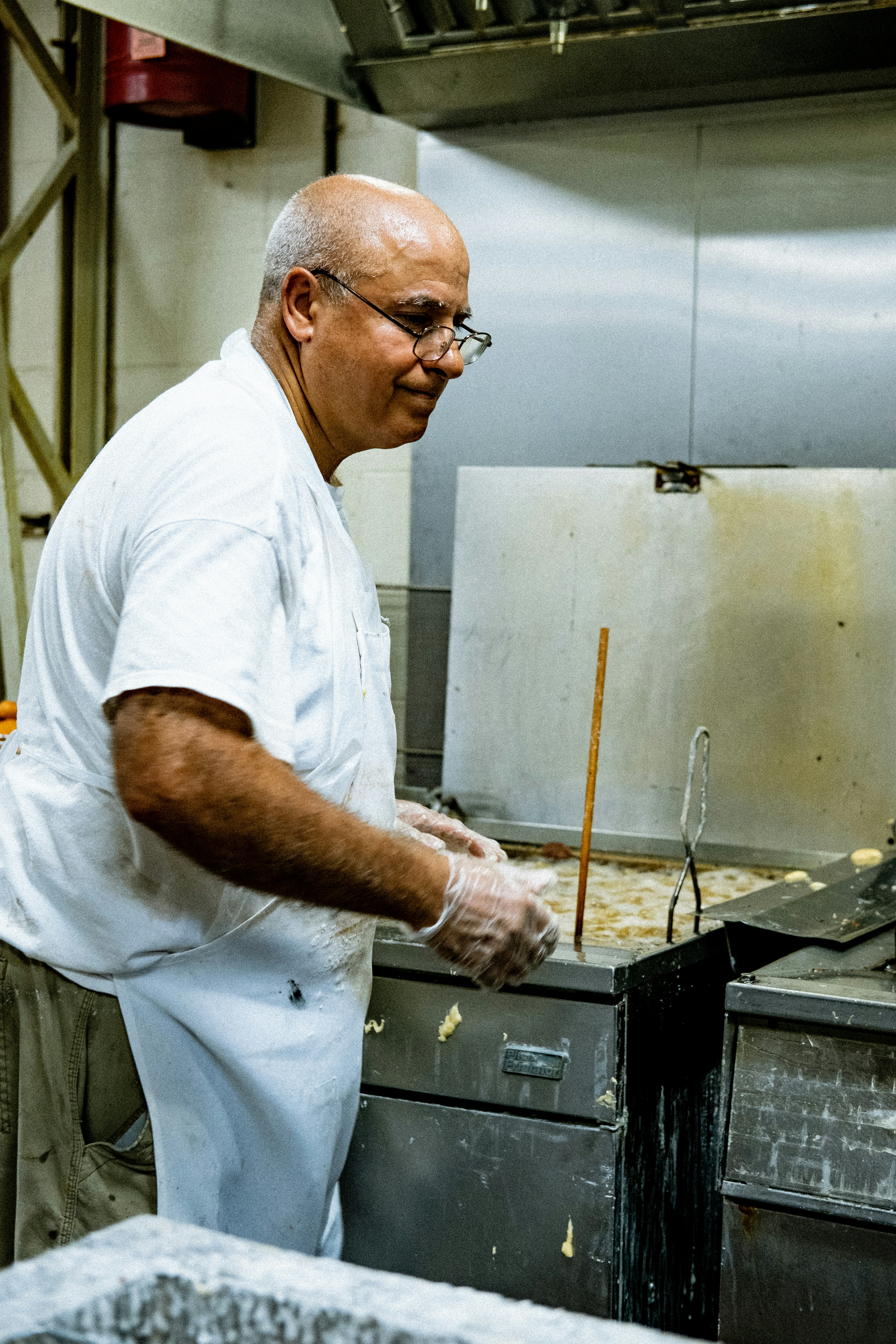 man in white chef uniform holding knife