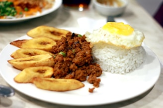fried egg and rice on white ceramic plate