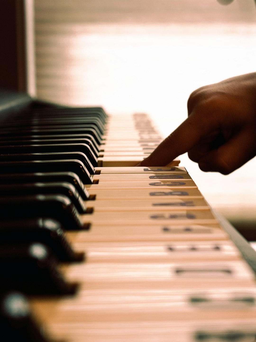 person playing piano during daytime