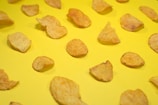 brown cookies on yellow surface