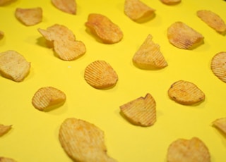 brown cookies on yellow surface