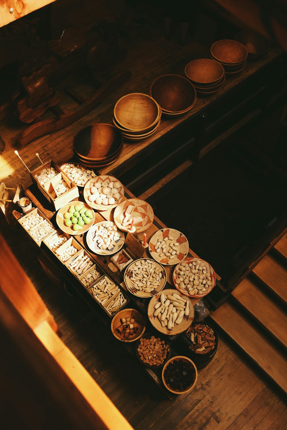 silver round coins on brown wooden table