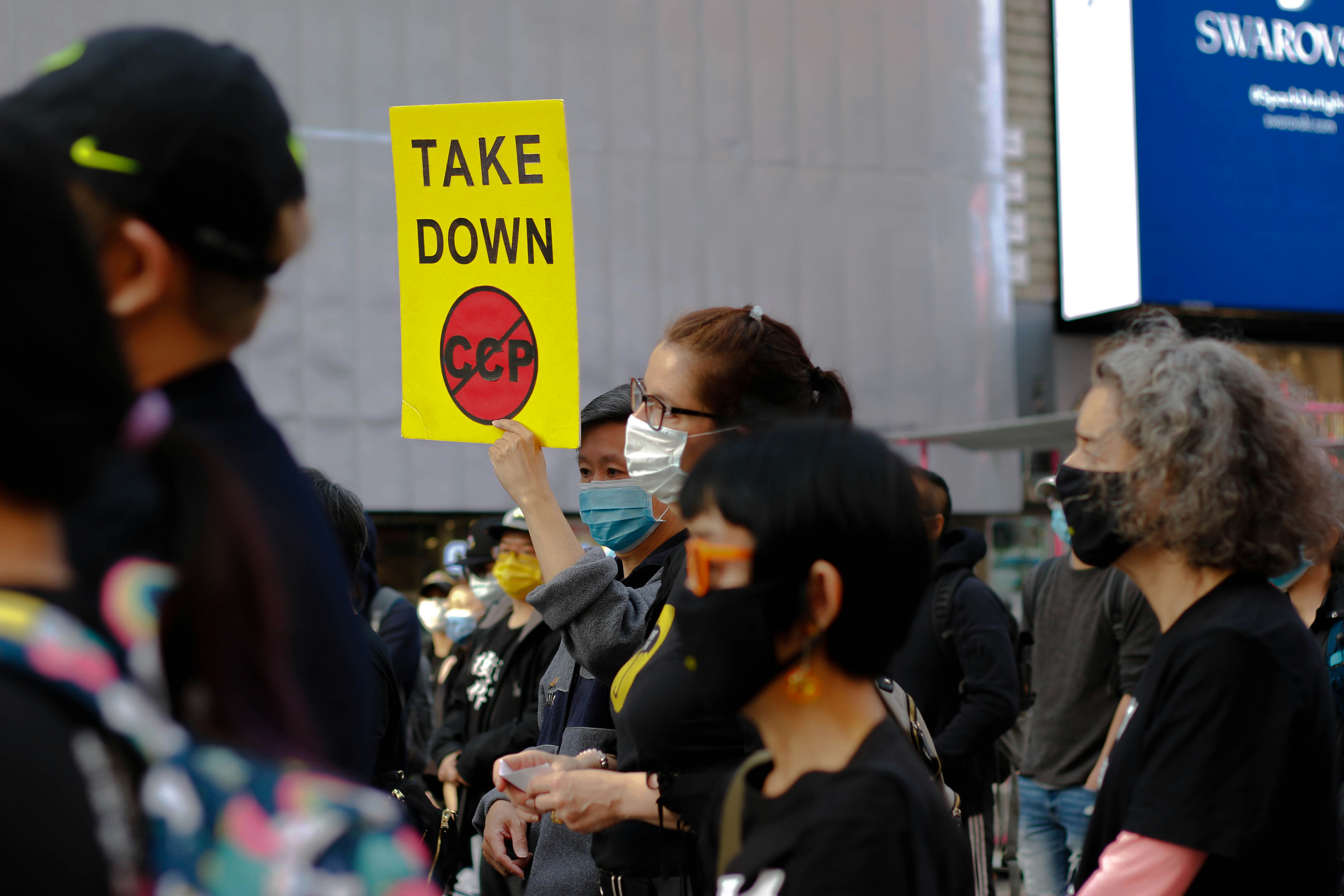 woman in black jacket holding smartphone