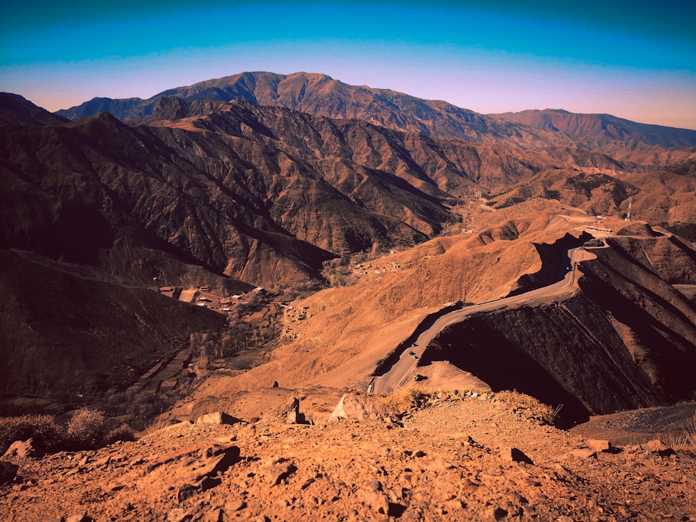 brown rocky mountain under blue sky during daytime