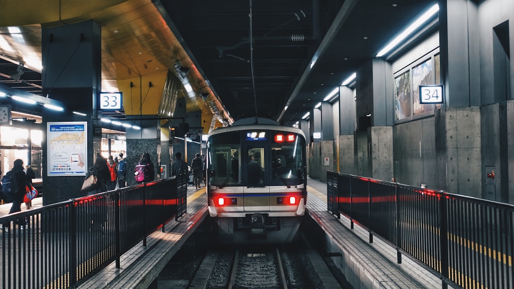 people walking on train station during daytime