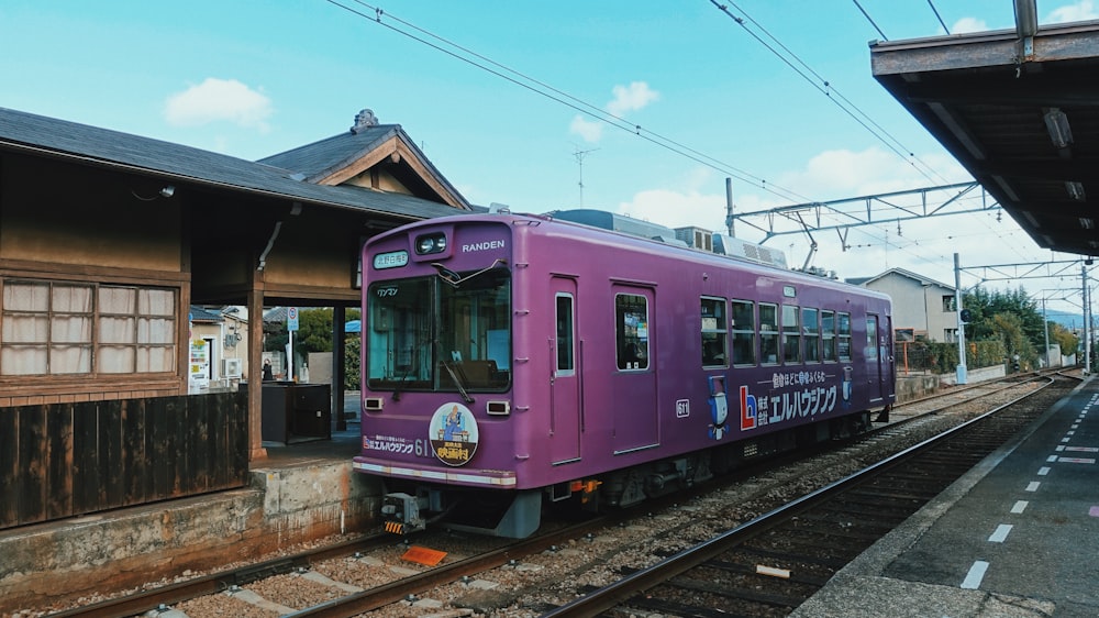 pink and white train on rail tracks during daytime