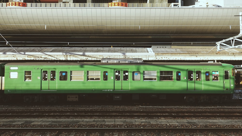 green train on train station