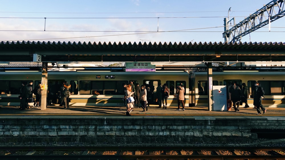 people walking on train station during daytime