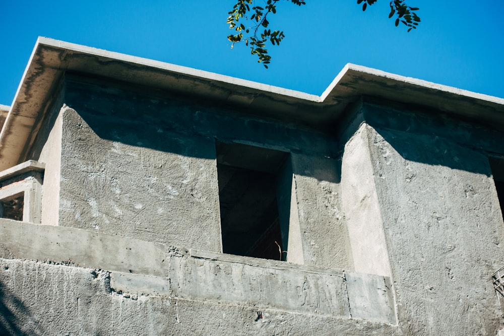 grey concrete building under blue sky during daytime