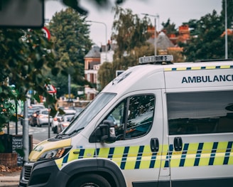 white and blue police car on road during daytime