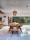 A modern dining area showcasing a beautiful wooden table.