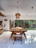 A modern dining area showcasing a beautiful wooden table.