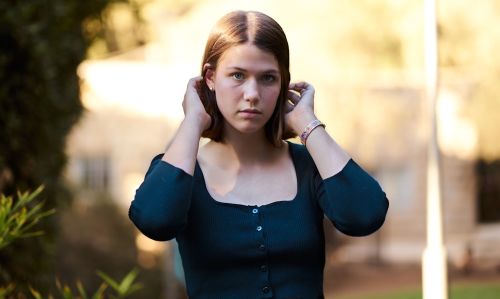 woman in blue long sleeve shirt