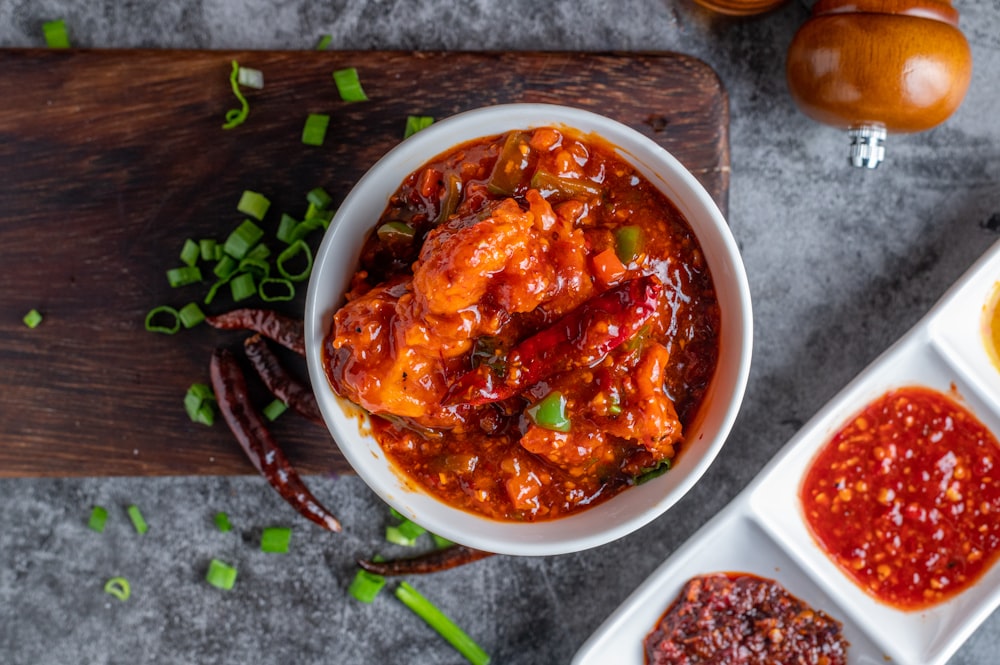 white ceramic bowl with red sauce