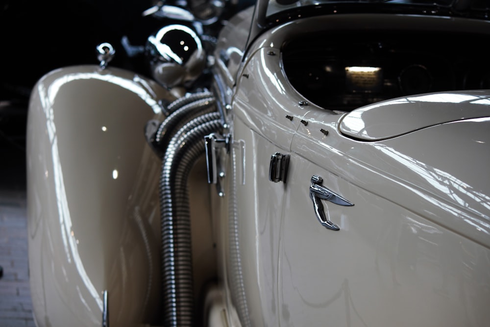 white car with chrome steering wheel