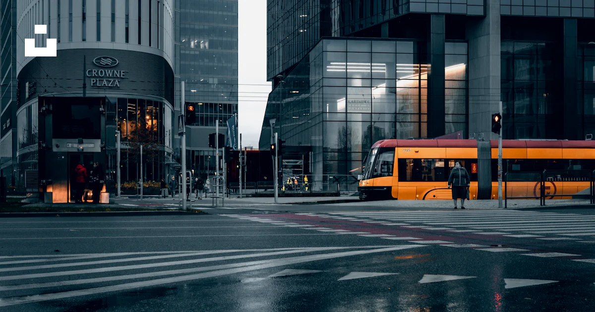 Yellow bus on road near high rise buildings during daytime photo – Free ...