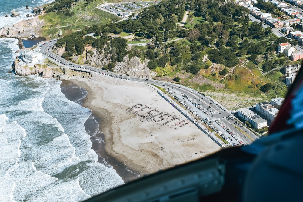 aerial view of city buildings near body of water during daytime