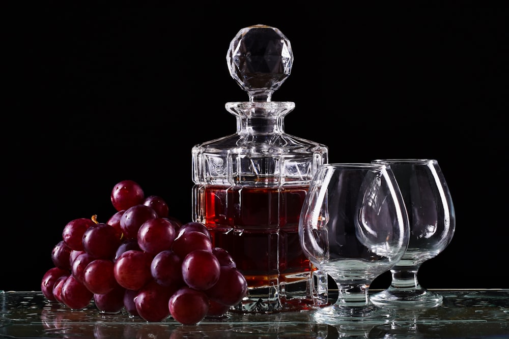 red round fruits in clear glass bowl