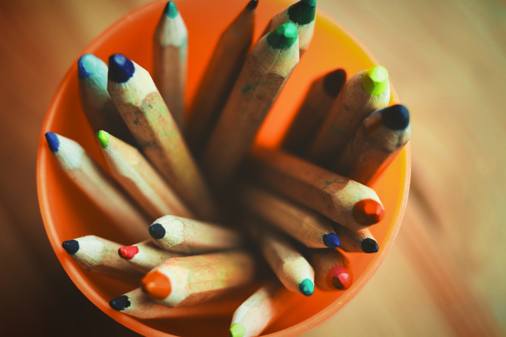coloring pencils on yellow plastic container