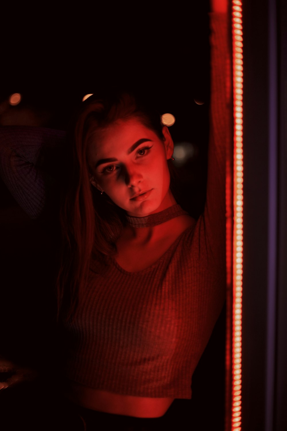 woman in red turtleneck shirt