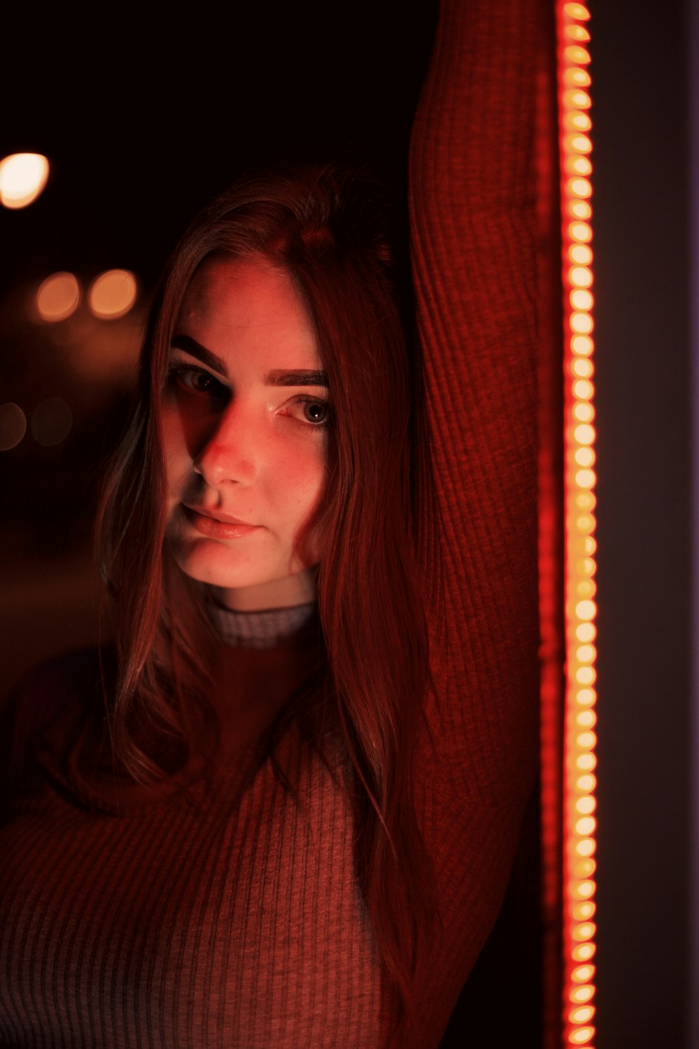 woman in red turtleneck sweater