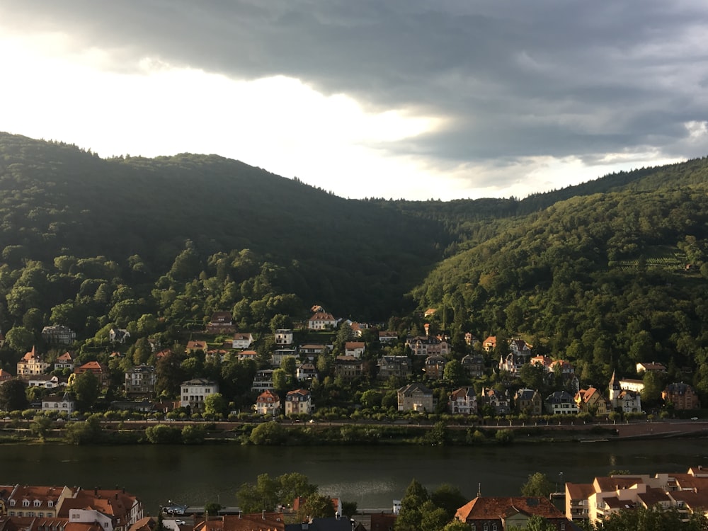 green mountains near body of water during daytime