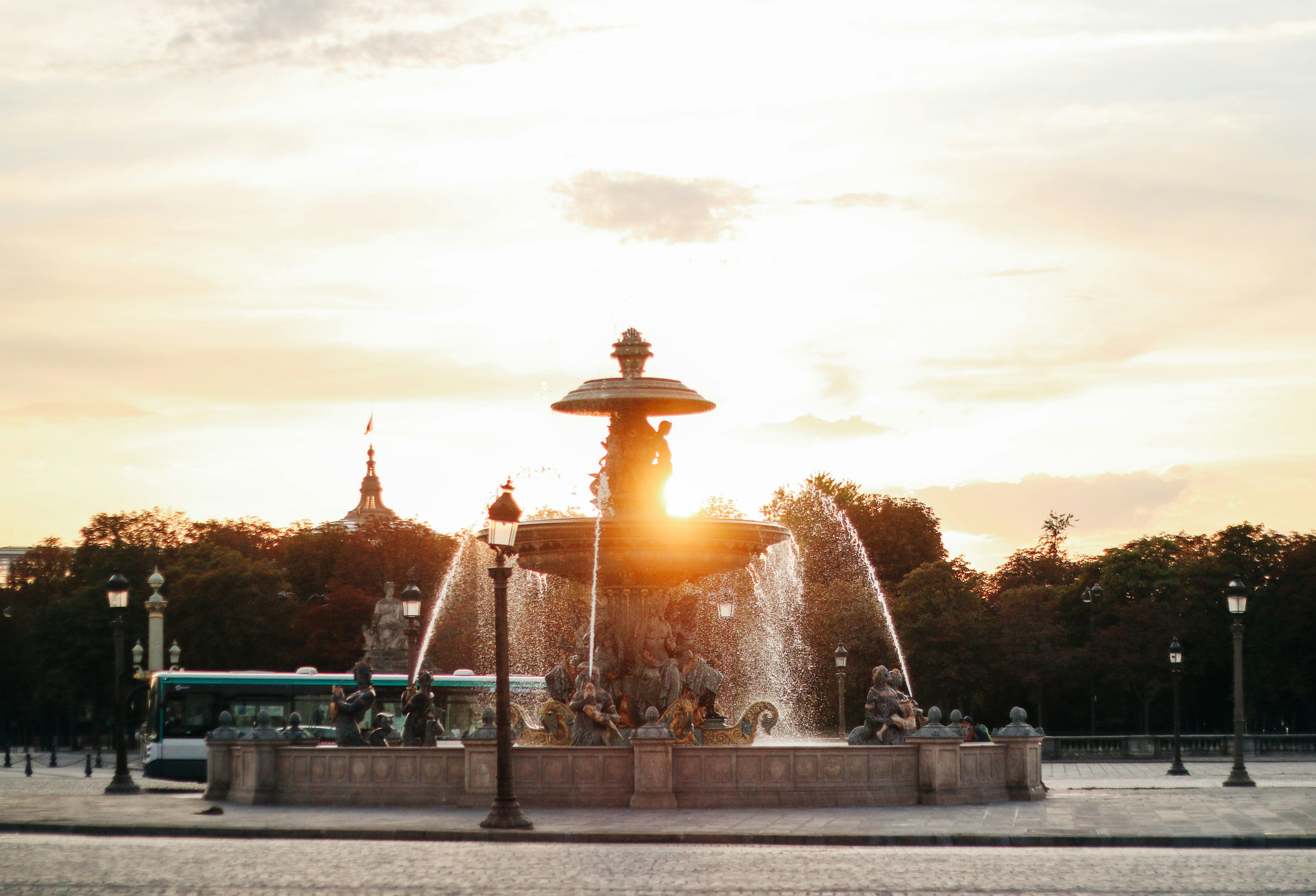 water fountain under cloudy sky during daytime, Photo of the fountain of the seas located on the place of the concorde next to the obelisk of the Concorde taken on 10/08/2020