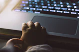 Illustration of a child confidently using a laptop with a guardian figure nearby
