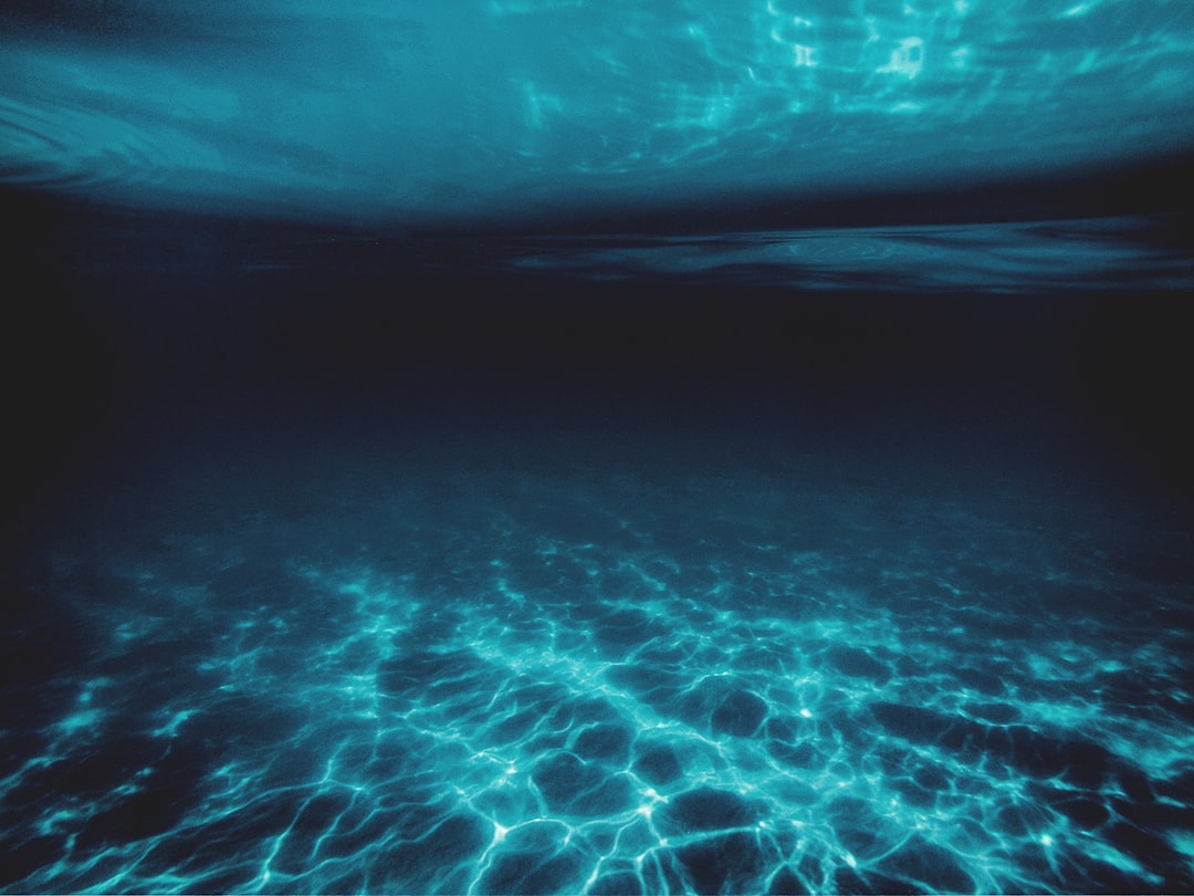 blue water with white bubbles,