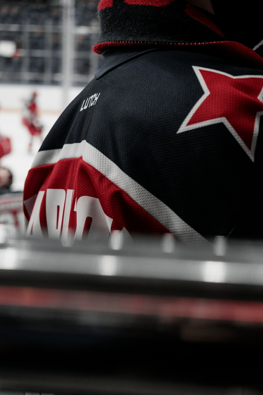 a hockey player wearing a red star jersey