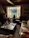 Elegant wooden bench displayed in a cozy rustic living room with warm lighting.