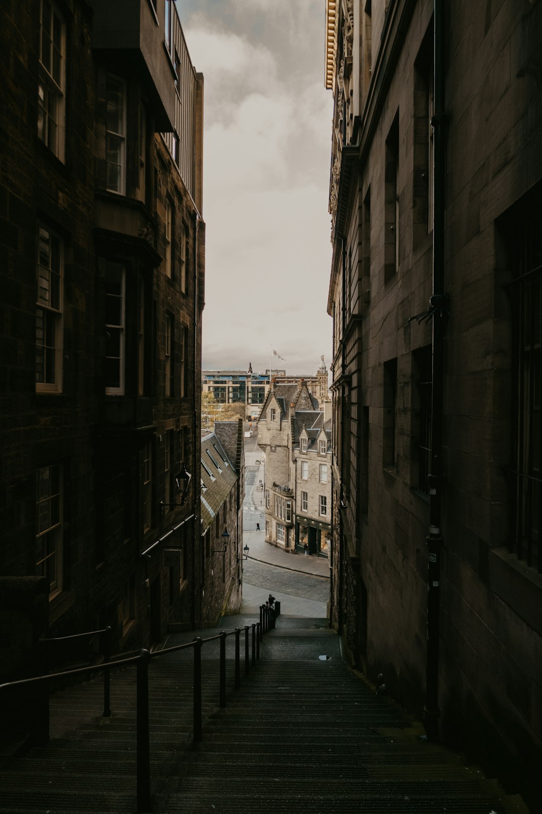 people walking on street between buildings during daytime