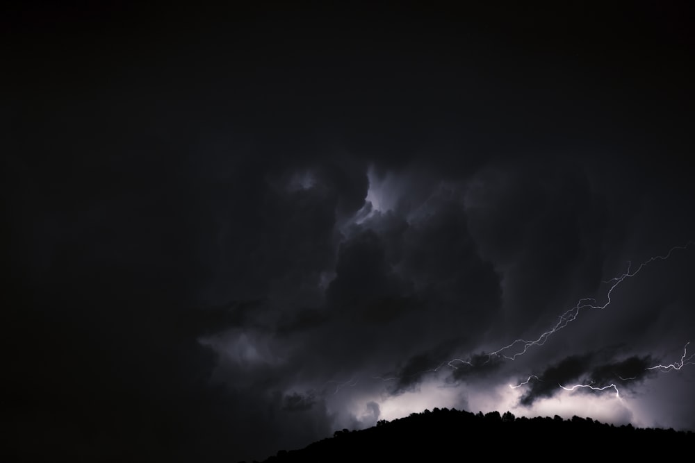 white clouds on black sky