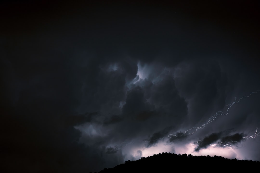 white clouds on black sky