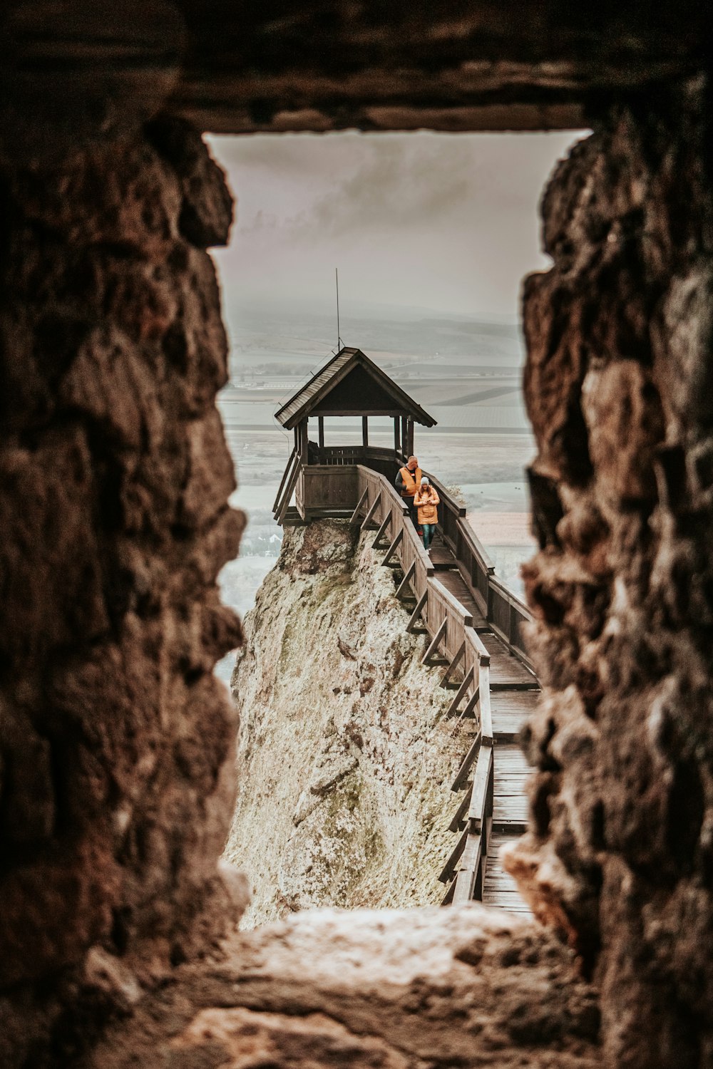 brown wooden house on cliff