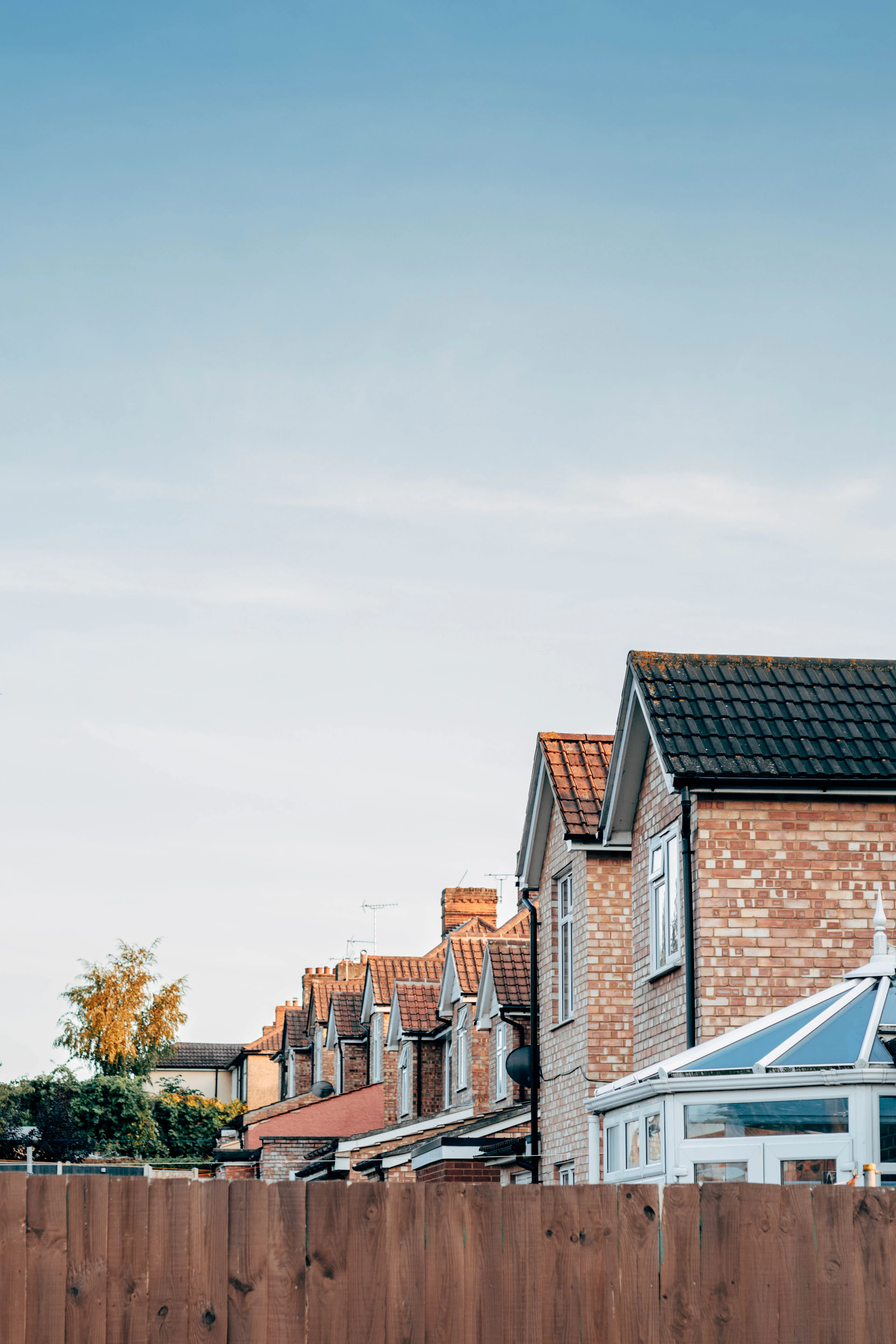 brown and white concrete houses under white sky during daytime
