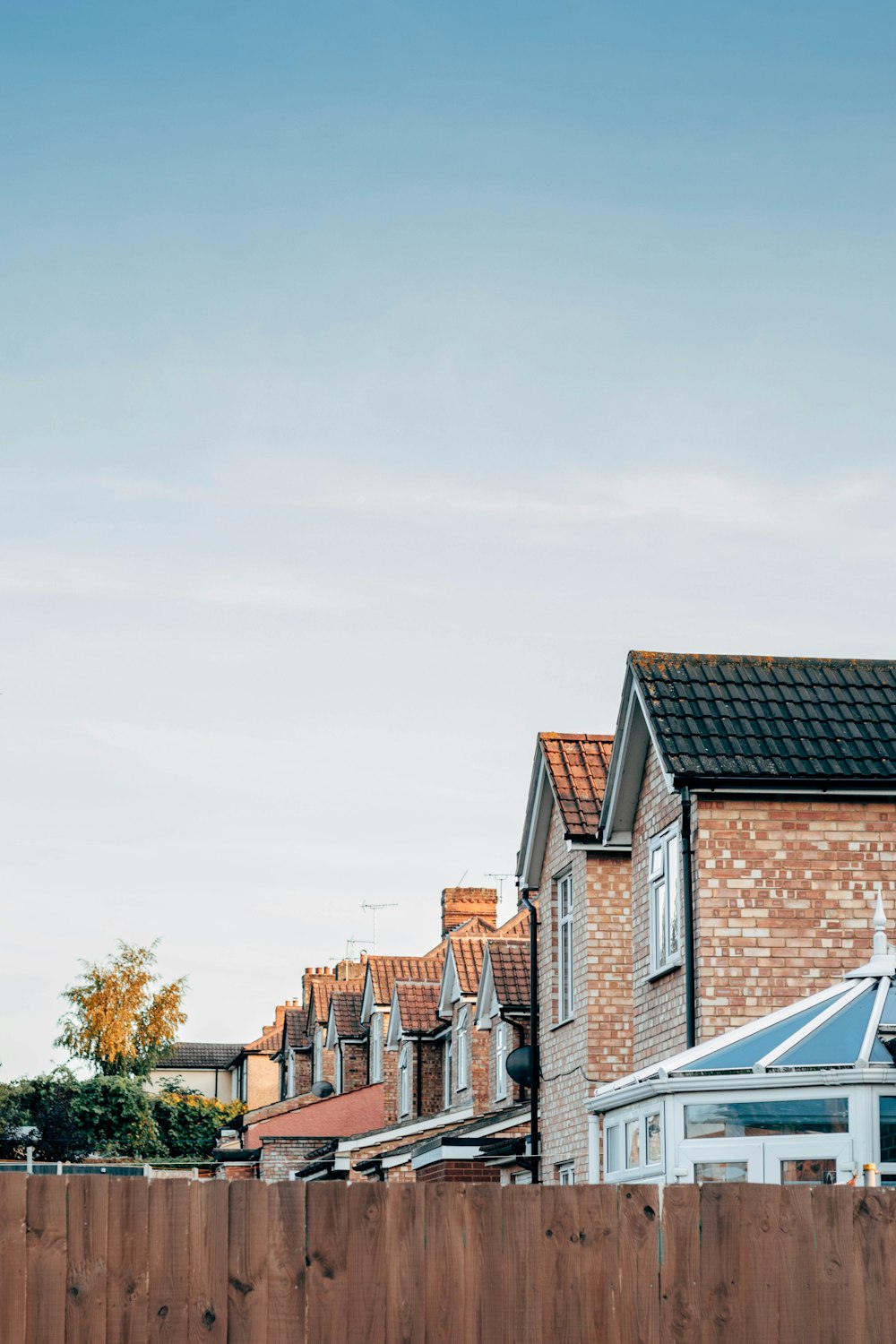 brown and white concrete houses under white sky during daytime