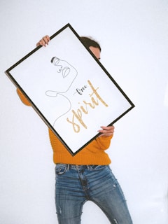 person holding white and black frame