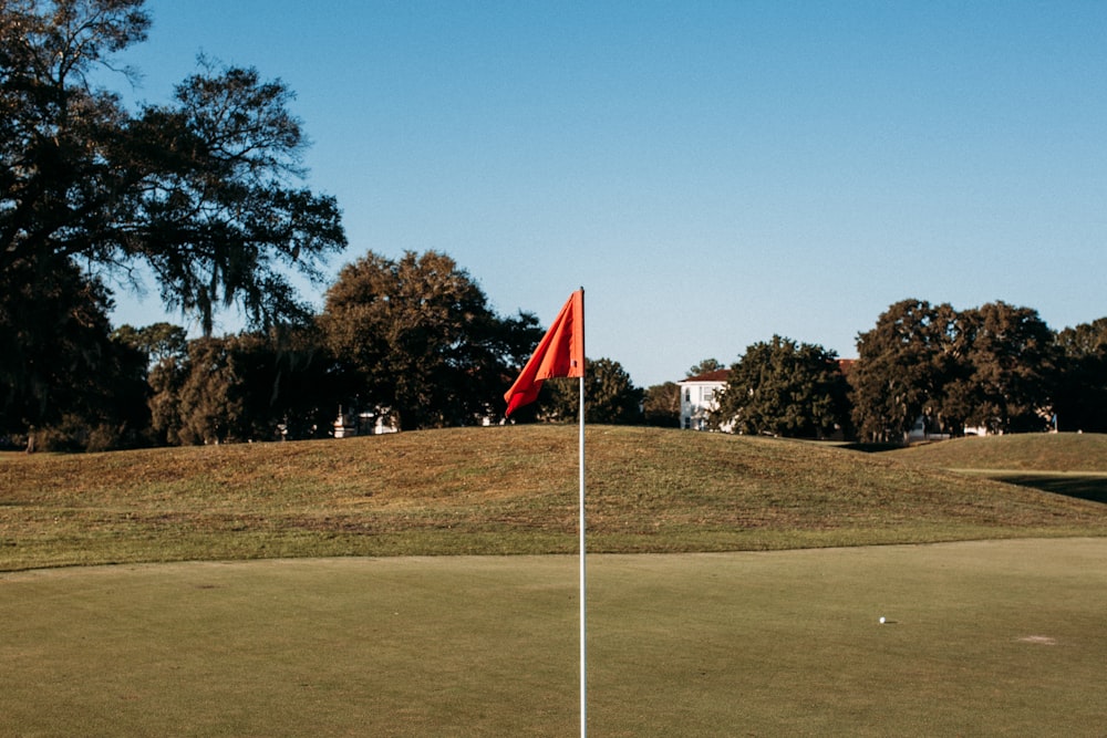 red and white flag on pole during daytime