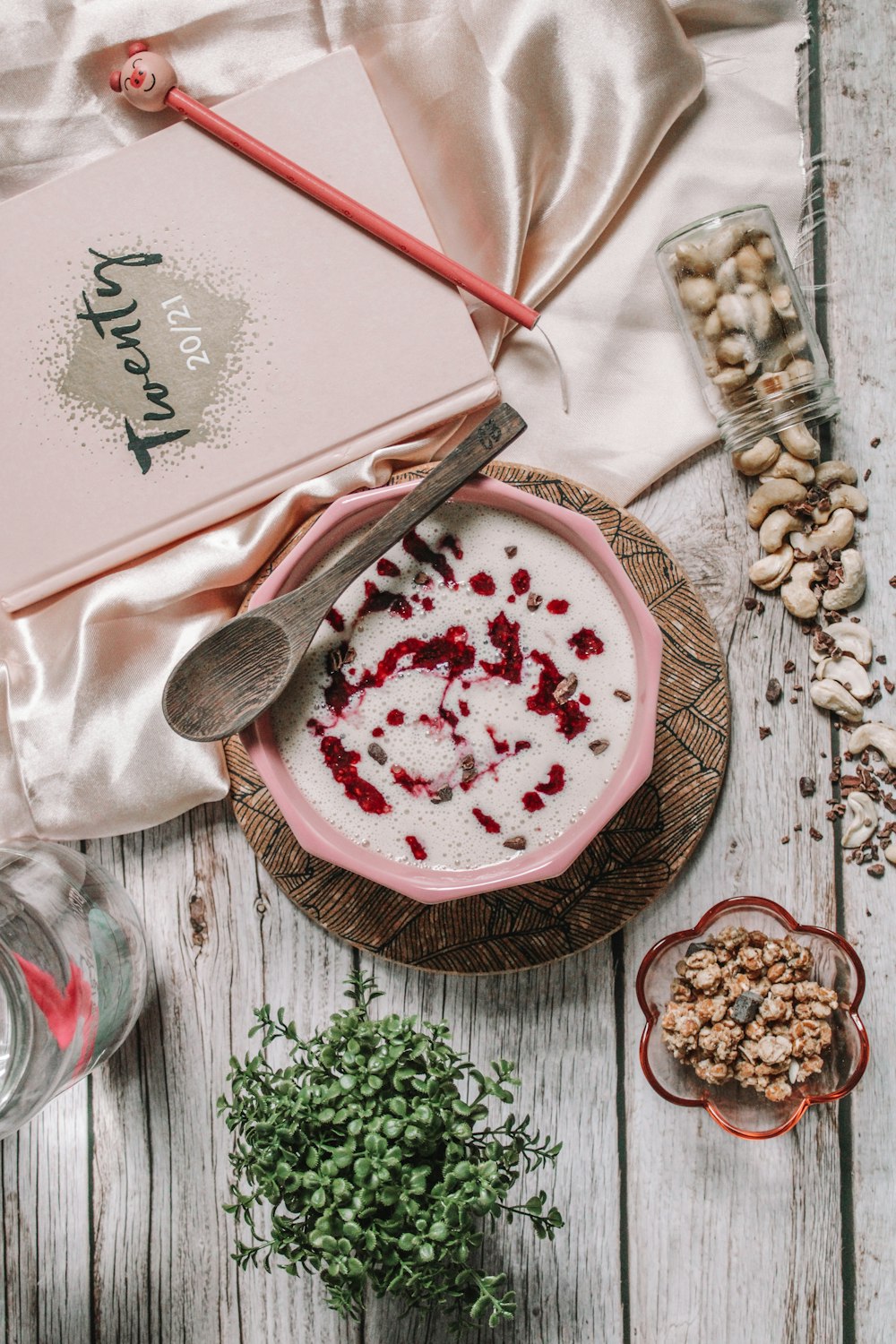 pink and white cake on brown wooden round tray