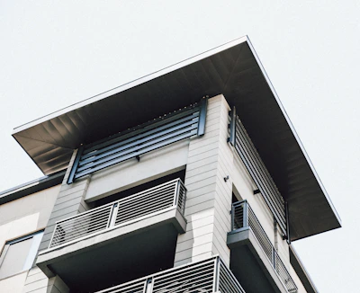 A stylish flat roof installation featuring clean lines and gold accents on a contemporary home.