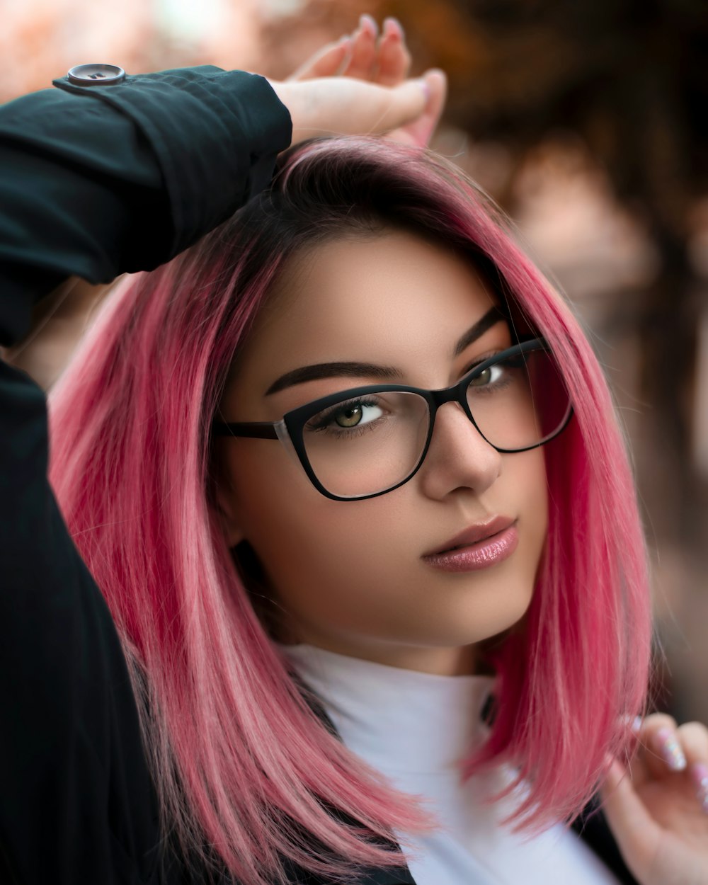 woman in black jacket wearing black framed eyeglasses